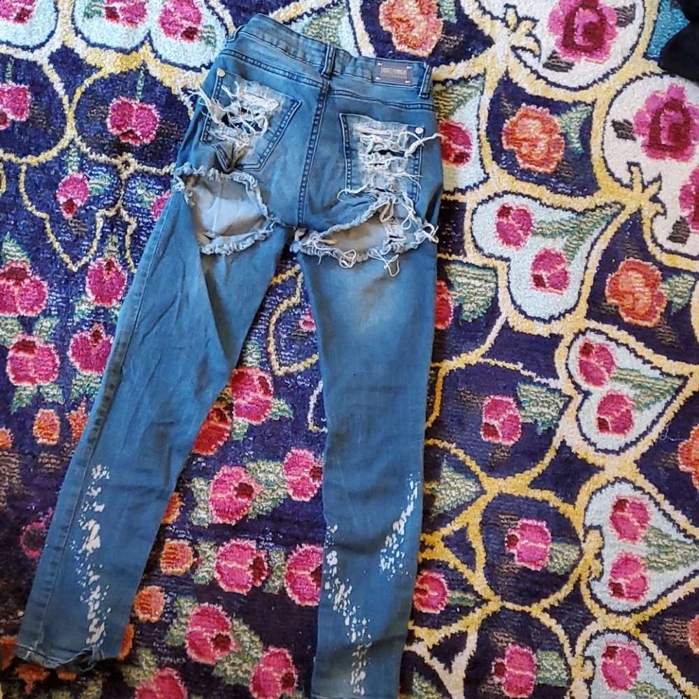 Blue jeans distressed and torn